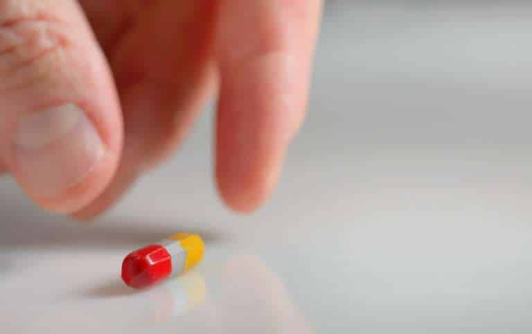 hand taking over the counter ambien alternative pill