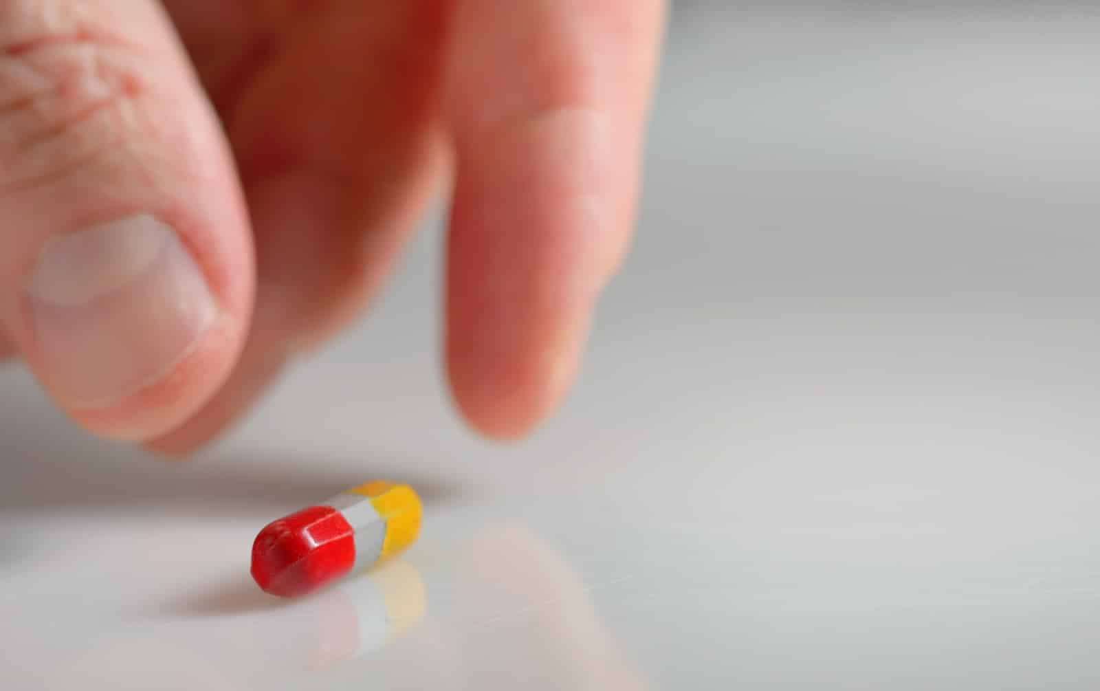 hand taking over the counter ambien alternative pill