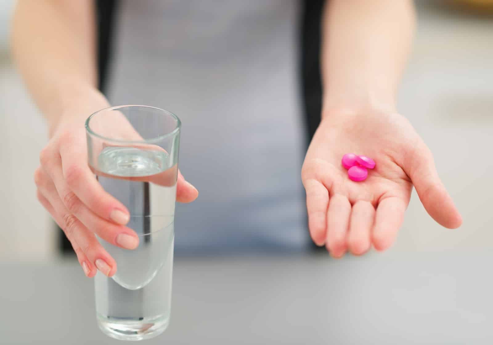 Closeup on pills in hand of person